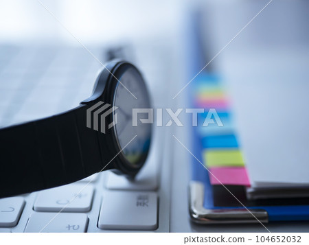 Binders and documents on the table, keyboard Binders and documents on the table, keyboard 104652032