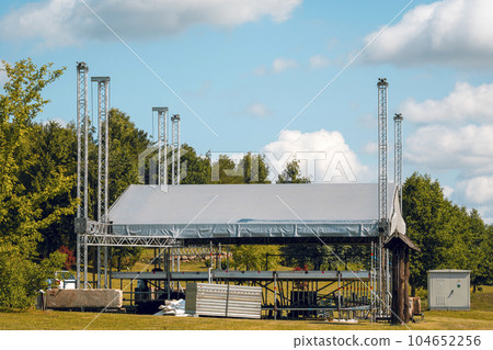 Building of outdoor concert stage on the rural landscape Building of outdoor concert stage on the rural landscape 104652256