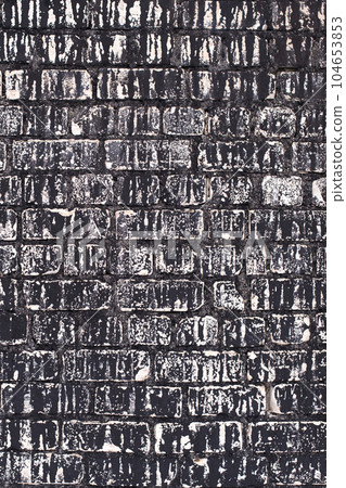 Old brick black color wall background. Dark stone texture 104653853