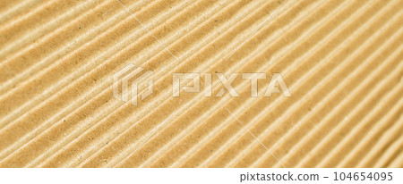 Brown and beige colored corrugated cardboard detail Brown and beige colored corrugated cardboard detail 104654095