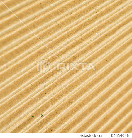 Brown and beige colored corrugated cardboard detail Brown and beige colored corrugated cardboard detail 104654096