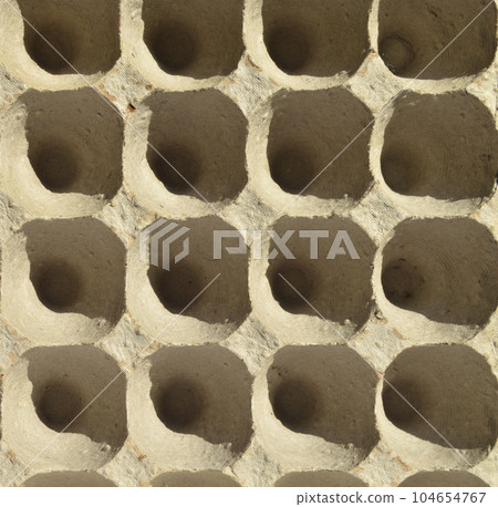 White and grey empty egg carton, recyclable egg container made of pulp White and grey empty egg carton, recyclable egg container made of pulp 104654767