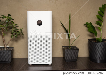 Close-up of a white indoor air purifier. Dust and allergy cleaner in the house 104655287