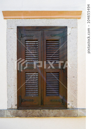 Ayvalik Cunda Adasi located in old antique house wooden windows, Turkey Balikesir Ayvalik Cunda Adasi located in old antique house wooden windows, Turkey Balikesir 104655494