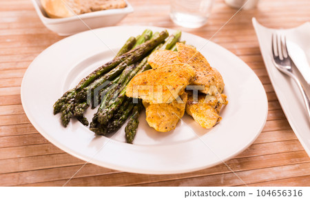 dietary meal rich in protein. Stir fried chicken breast and green asparagus dietary meal rich in protein. Stir fried chicken breast and green asparagus 104656316