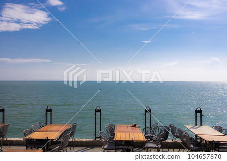 Summer terrace with stylish trendy outdoor furniture at a luxurious travel destination. Summer terrace with stylish trendy outdoor furniture at a luxurious travel destination. 104657870