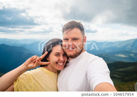 A happy couple on the mountain A happy couple on the mountain 104657954