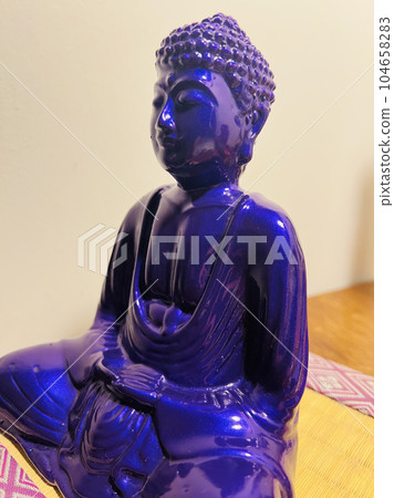 A Buddha statue sitting on a tatami mat A Buddha statue sitting on a tatami mat 104658283