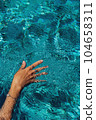 Swimming in a pool. Summer holidays concept. 104658311
