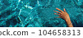 Swimming in a pool. Summer holidays concept. 104658313