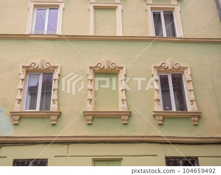 Green facade of the house in the central part of Lviv, Ukraine 104659492