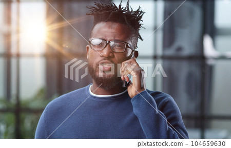 business people, communication and technology concep african american businessman calling on smartphone at office 104659630