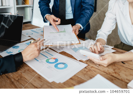Asian business advisor meeting to analyze and discuss the situation on the financial report in the meeting room.Investment Consultant, Financial , teamwork ,brainstorming ,startup and accounting. 104659701
