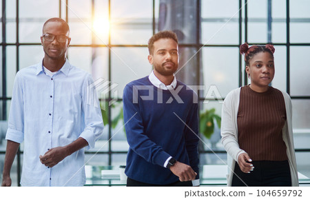 Successful african american business team standing with arms crossed in the office Successful african american business team standing with arms crossed in the office 104659792