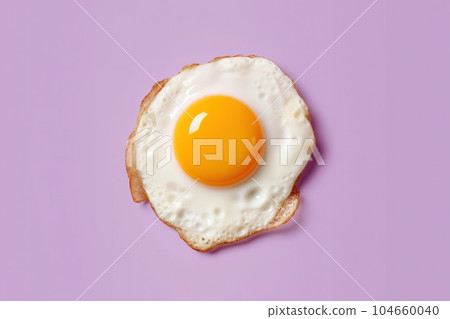 Delicious scrambled eggs in purple background isolated top view Delicious scrambled eggs in purple background isolated top view 104660040