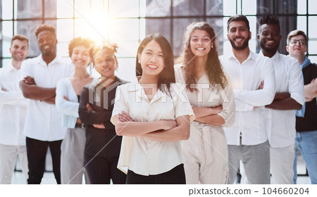 happy team of diverse corporate employees in the office lobby. 104660204