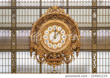 Ornamental golden clock in Orsay Museum, French: Musee d Orsay, in former train station building, Paris, France. Ornamental golden clock in Orsay Museum, French: Musee d Orsay, in former train station building, Paris, France. 104661234