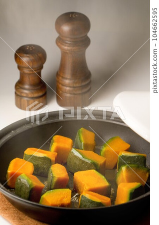 Cooking pumpkin in a tagine pot 104662595
