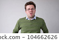 The angry European young man wearily looks. He is without strength and energy 104662626