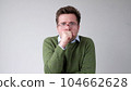 The angry European young man wearily looks. He is without strength and energy 104662628