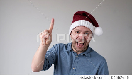 Funny Man in a New Year's Hat Counts Fingers, like Shows Numbers Funny Man in a New Year's Hat Counts Fingers, like Shows Numbers 104662636