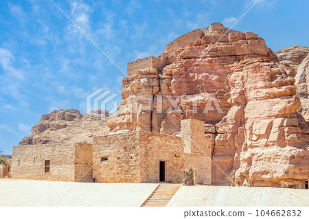 Al Ula old town street with castle walls on the hill, Medina province, Saudi Arabia Al Ula old town street with castle walls on the hill, Medina province, Saudi Arabia 104662832