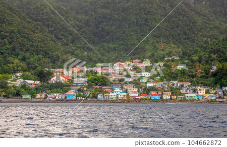 Seashore view to Pointe Michel town with colourful houses, Dominica, West, Indies, Caribbean sea 104662872