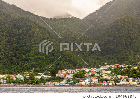 Seashore view to Pointe Michel town with colourful houses, Dominica, West, Indies, Caribbean sea Seashore view to Pointe Michel town with colourful houses, Dominica, West, Indies, Caribbean sea 104662873