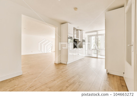 an empty living room with hardwood flooring and white walls in the room is very clean, but it's hard to see an empty living room with hardwood flooring and white walls in the room is very clean, but it's hard to see 104663272