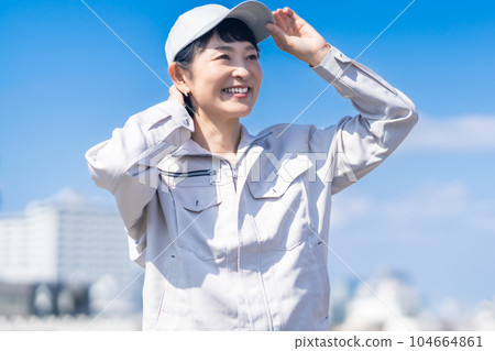 Middle female manager wearing work clothes 104664861