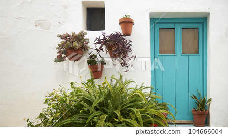 An old house in a romantic city. Colorful and beautiful gates made of wood. vintage door. An old house in a romantic city. Colorful and beautiful gates made of wood. vintage door. 104666004