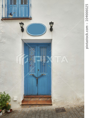 An old house in a romantic city. Colorful and beautiful gates made of wood. vintage door. 104666025