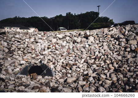 underground drainage storm drain with winged walls surrounded by rock for erosion control underground drainage storm drain with winged walls surrounded by rock for erosion control 104666260