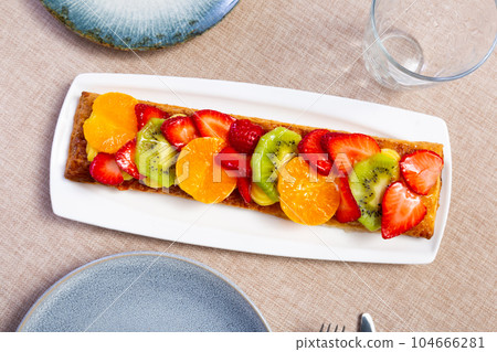 Puff pastry with fruits and berries served on napkin Puff pastry with fruits and berries served on napkin 104666281