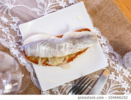 Appetizing sandwich with lightly salted herring 104666282