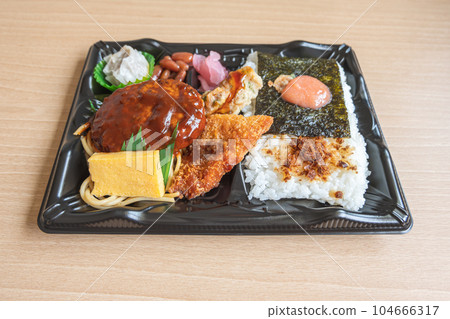 Japanese bento set lunch box of hamburger steak, seaweed on rice, fried fish and Japanese rolled omelet Japanese bento set lunch box of hamburger steak, seaweed on rice, fried fish and Japanese rolled omelet 104666317