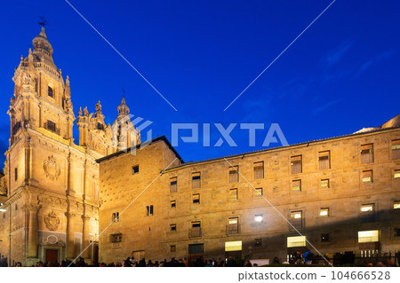 Salamanca cityscape at twilight with central square, Casa de las Conchas and La Clerecia Salamanca cityscape at twilight with central square, Casa de las Conchas and La Clerecia 104666528