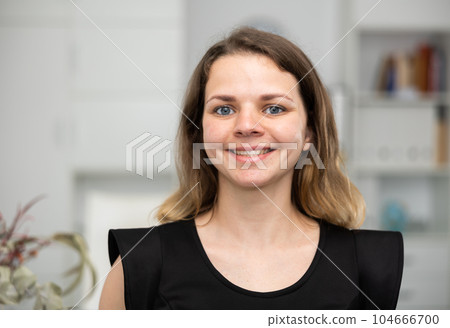 Portrait of positive woman office worker 104666700