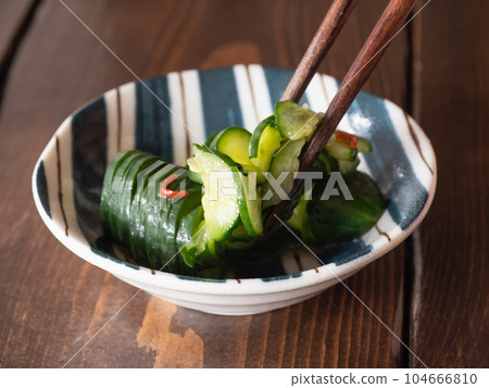 Spicy pickled cucumber. Japanese food with fresh vegetables. Spicy pickled cucumber. Japanese food with fresh vegetables. 104666810