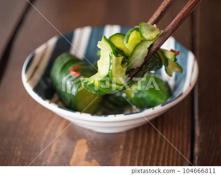 Spicy pickled cucumber. Japanese food with fresh vegetables. Spicy pickled cucumber. Japanese food with fresh vegetables. 104666811