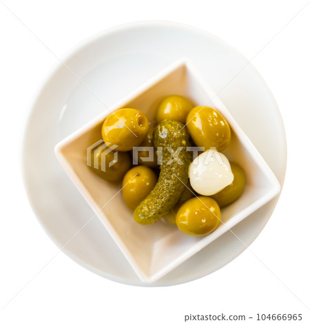 Green olives served with cucumber and onion on plate Green olives served with cucumber and onion on plate 104666965
