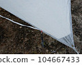 Early morning with frost on the tarp in the woods 104667433