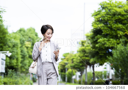 Female career woman smartphone search Female career woman smartphone search 104667568