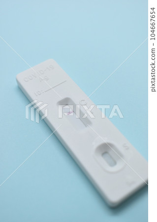 covid test kit on blue background 104667654