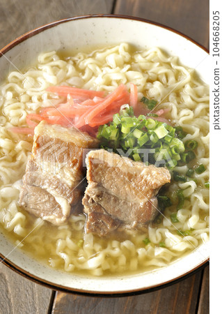 A bird's-eye view of hot Okinawa soba with pork ribs, plenty of small green onions, and pickled ginger 104668205