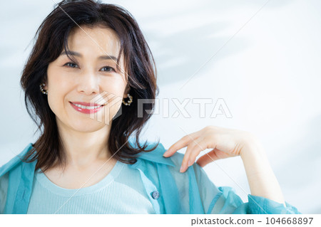 middle lady in aqua blue shirt 104668897