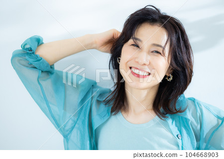 middle lady in aqua blue shirt middle lady in aqua blue shirt 104668903