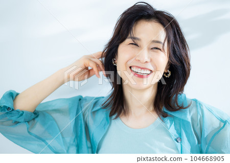 middle lady in aqua blue shirt middle lady in aqua blue shirt 104668905