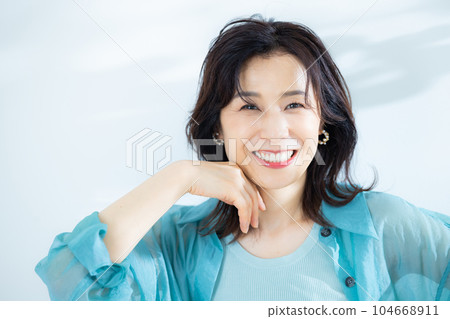 middle lady in aqua blue shirt middle lady in aqua blue shirt 104668911