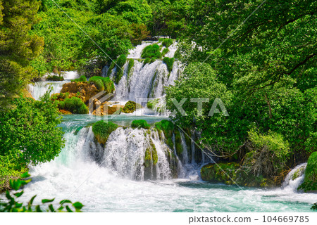 Beautiful Waterfall background. Beautiful Waterfall In Krka National Park - Croatia, Europe 104669785